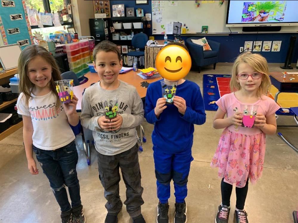  first graders show off their crazy hair grass projects